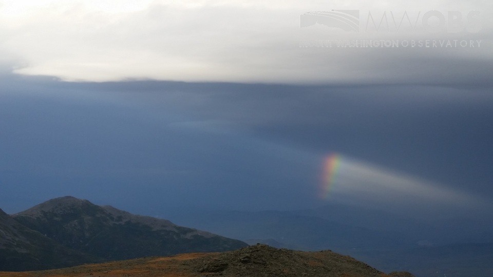 Partial rainbow and crepuscular rays at the end of summer