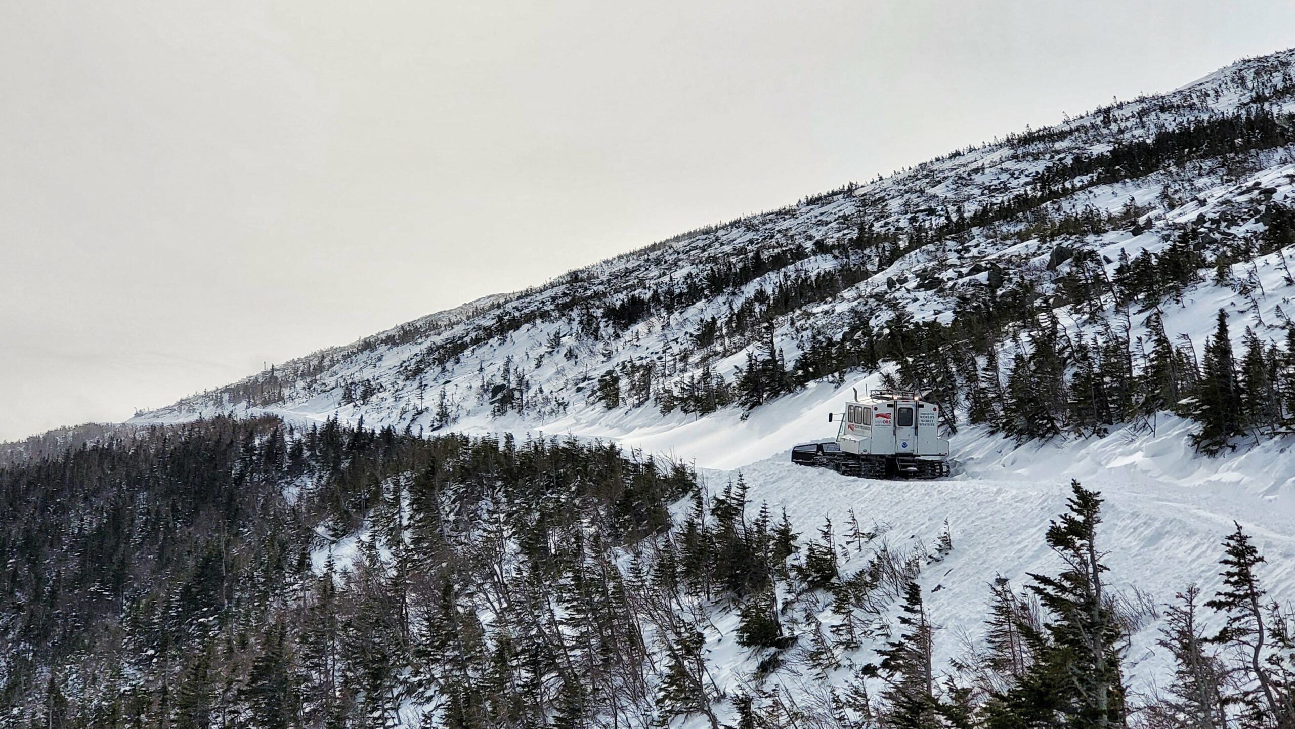 Snowcat driving to summit