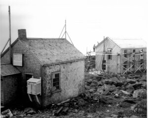 The 1937 building under construction. Camden Cottage, temporary home of the Observatory in the mid-1930s, in the foreground.
